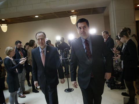 House Intelligence Committee Chairman Rep. Devin Nunes, R-Calif. (right), and the committee's ranking member Rep. Adam Schiff, D-Calif., depart after a briefing with FBI Director Jim Comey about Russian influence on the American presidential election